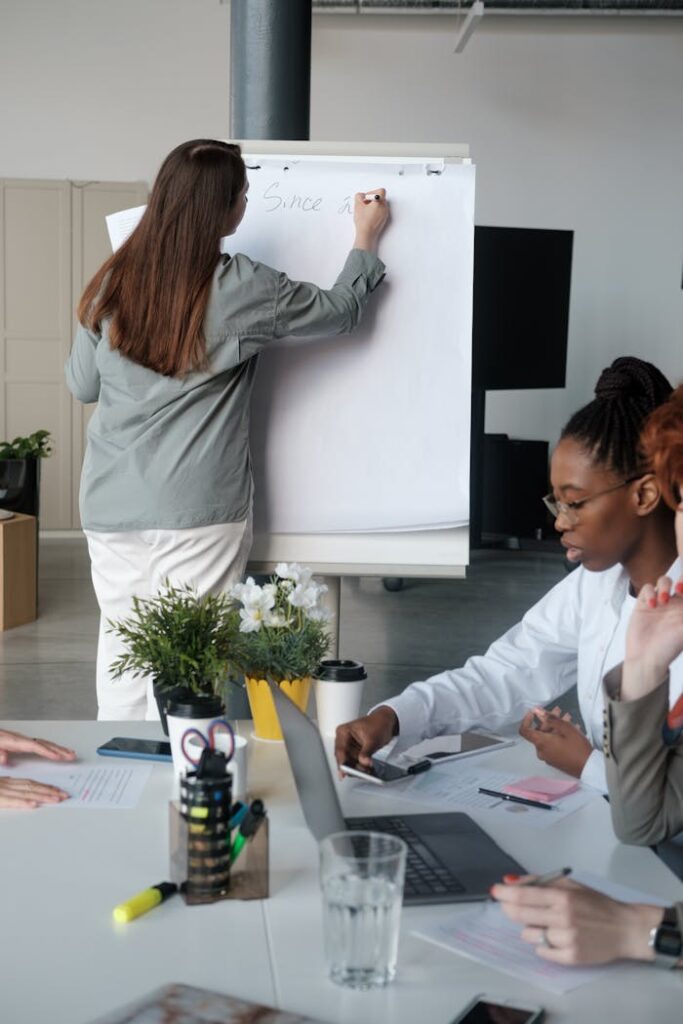 Professional team engaged in a brainstorming session at the office with a focus on planning and cooperation.